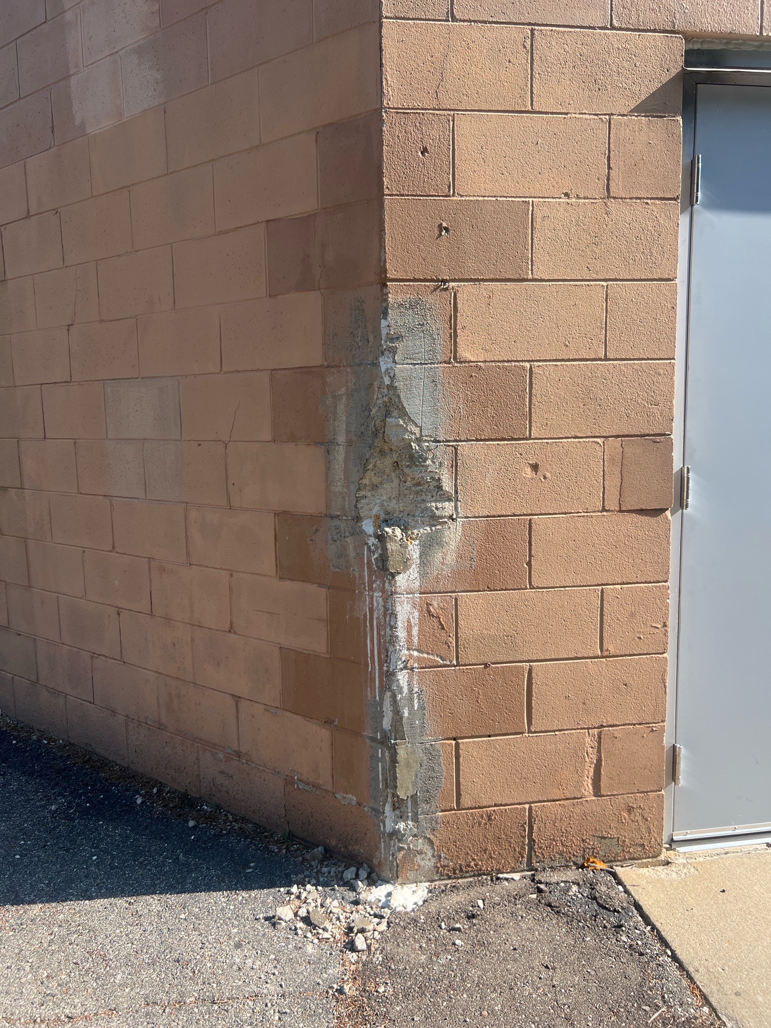 Cracked and repaired CMU foundation wall during a commercial inspection